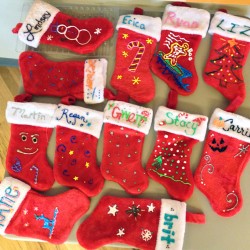 Personalized Christmas stockings bring holiday cheer to the office.