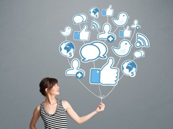 Image of woman hold social media icons