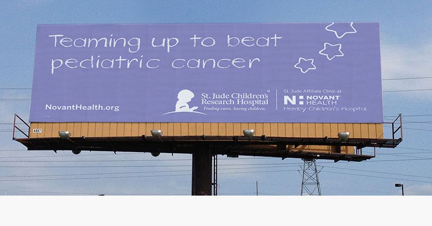 Novant Health and St. Jude affiliation healthcare billboard in Charlotte, NC